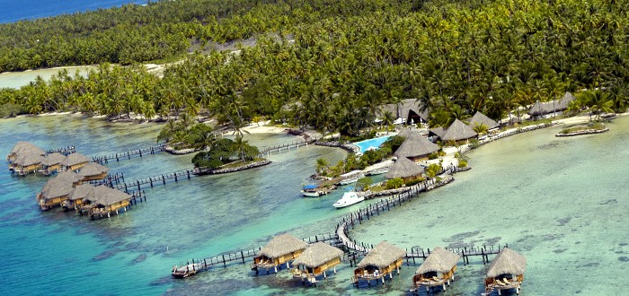 Overwater bungalows on Manihi Lagoon